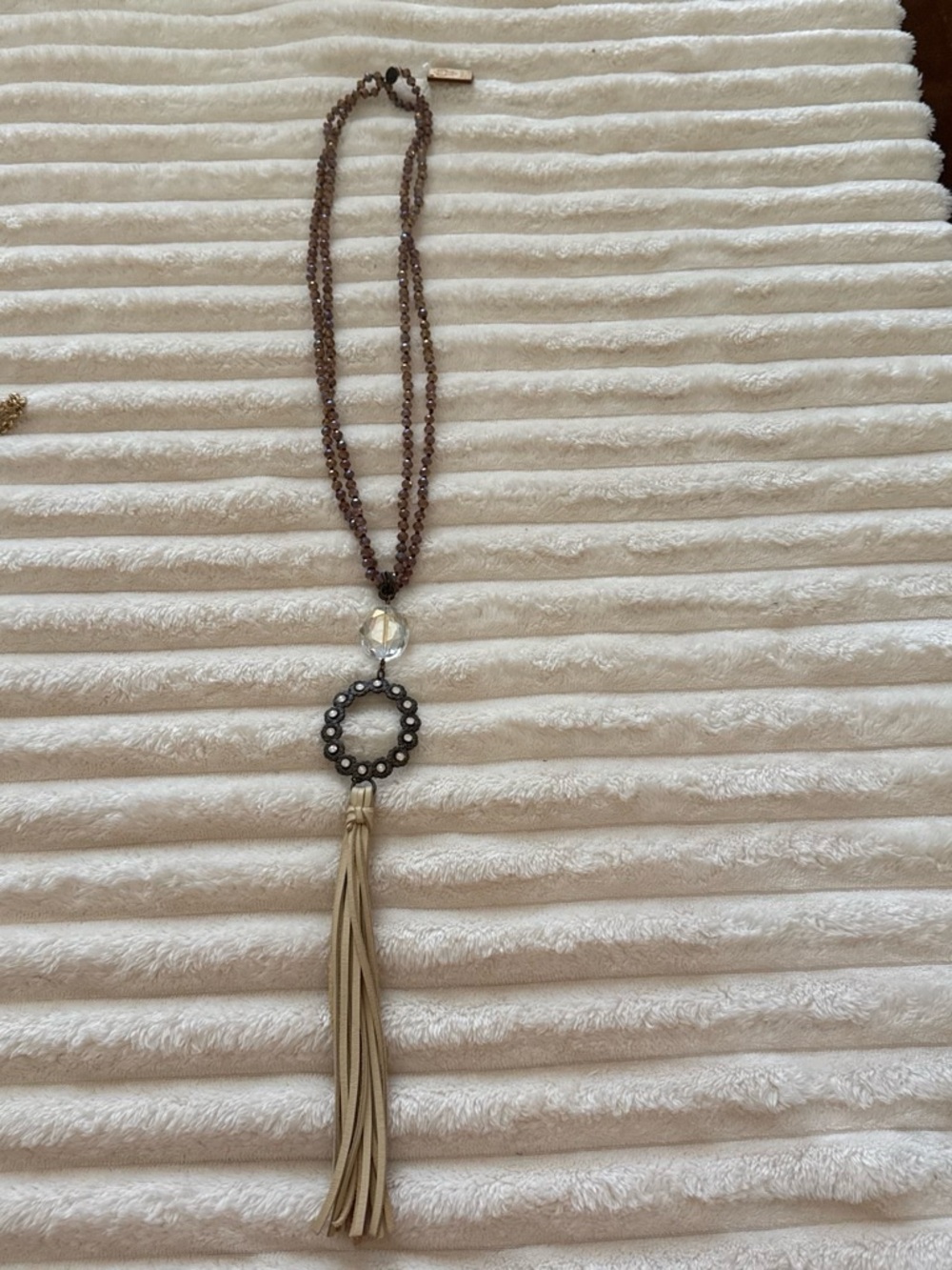 Brown Beaded Necklace with Cream Tassel and Decorative Pendant